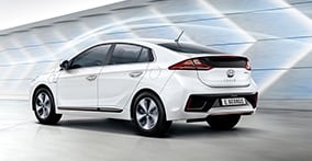 Side rear view of white Ioniq electric with aerodynamic design